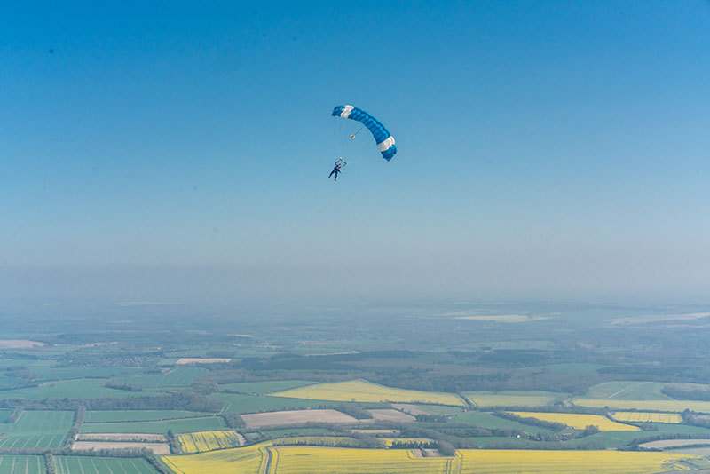 Skydiver with parachute deployed.
